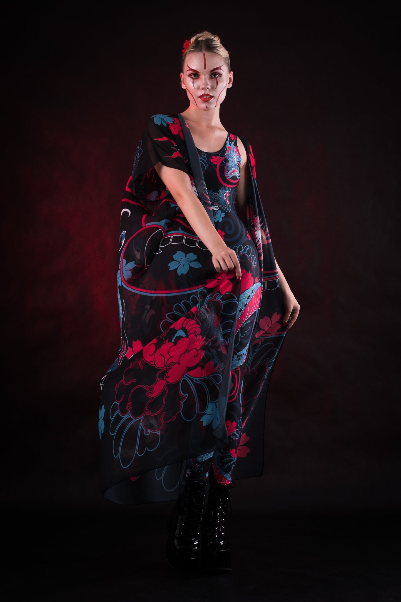 Woman wearing the Oriental Blossom Kimono, featuring vibrant floral accents, perfect for themed events, festivals, or stylish everyday wear.