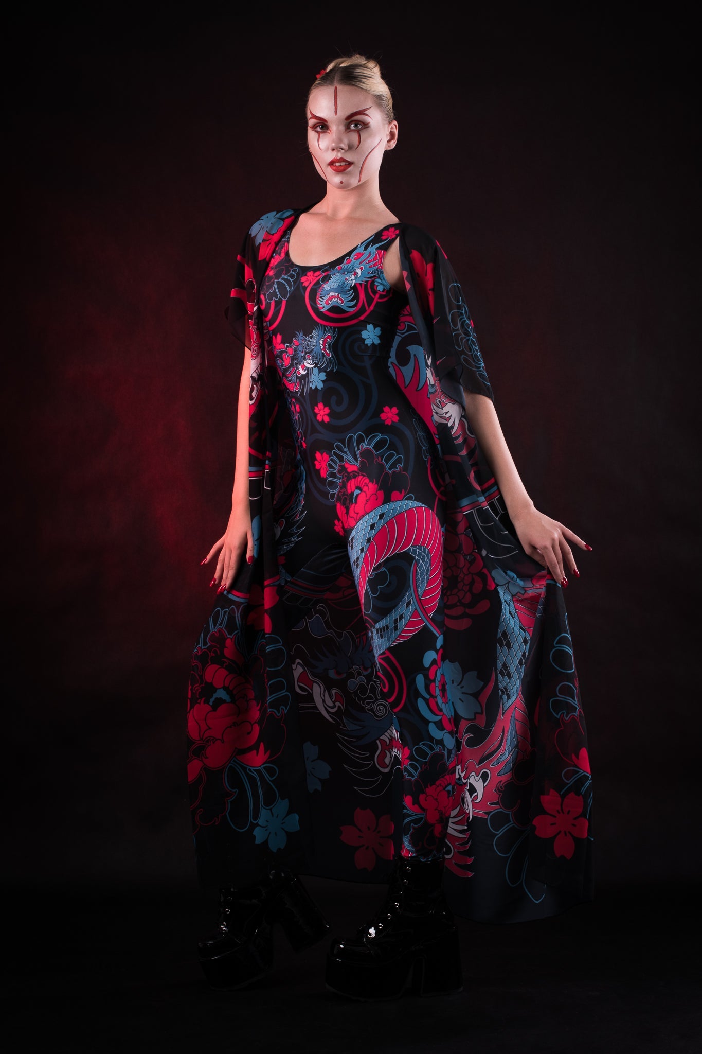 Woman posing in the Oriental Blossom Kimono, highlighting the intricate floral design and flowing fabric, great for Halloween or as a versatile fashion piece.