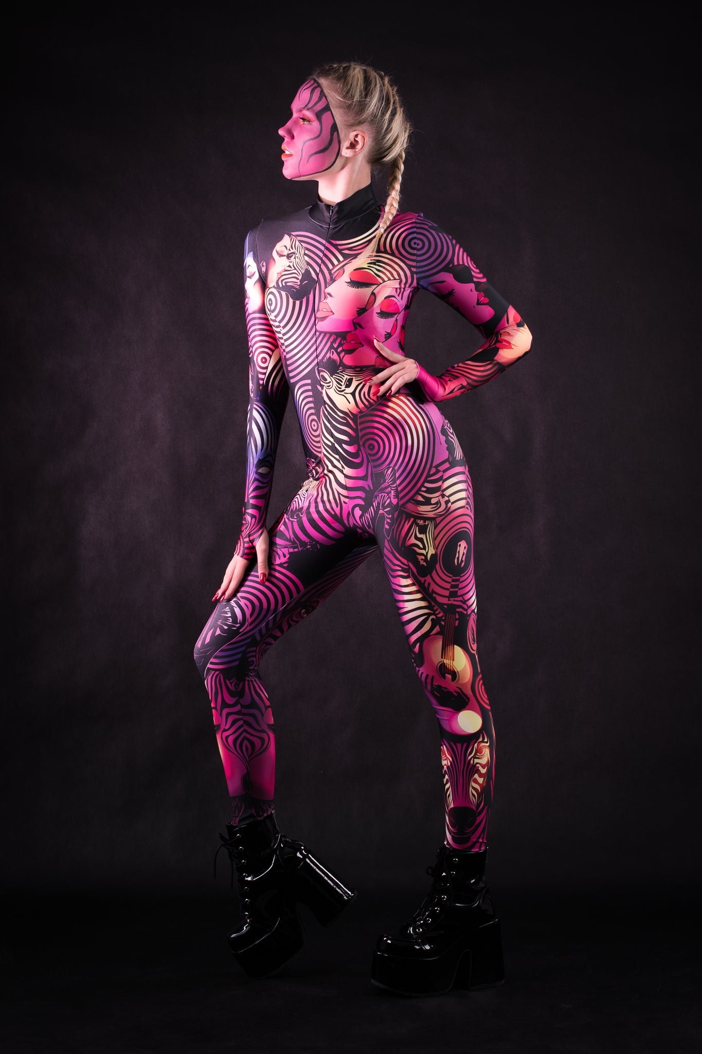 Woman wearing the Pink Zebra Femme costume, a full-body suit with striking pink zebra stripes, ideal for Halloween events or fun party outfits.