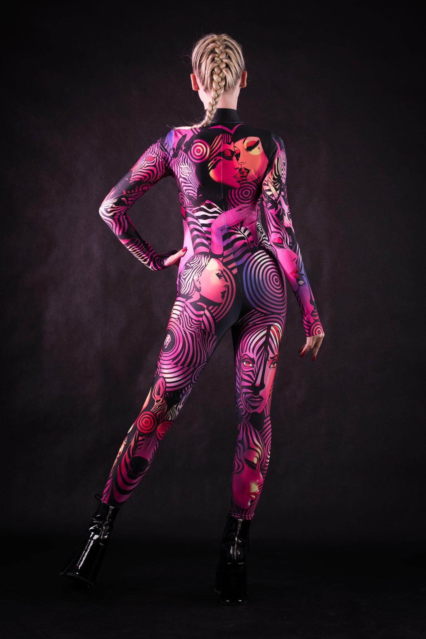 Woman posing in the Pink Zebra Femme Halloween costume, highlighting the bright pink zebra design, perfect for Halloween parties, festivals, or as a statement look.