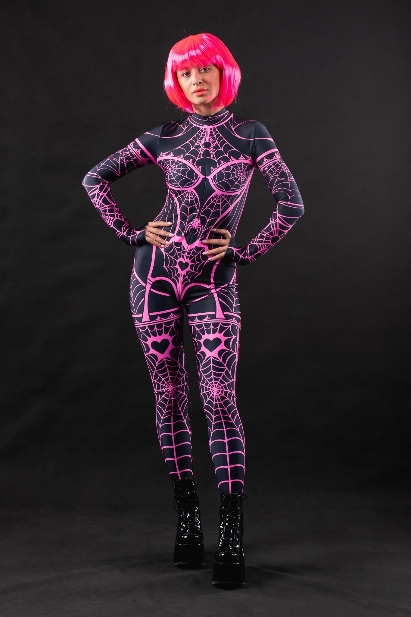 Pink Neon Spiderweb UV Reactive costume for women, featuring a vibrant spiderweb design that glows under UV light, perfect for Halloween, raves, or festivals.