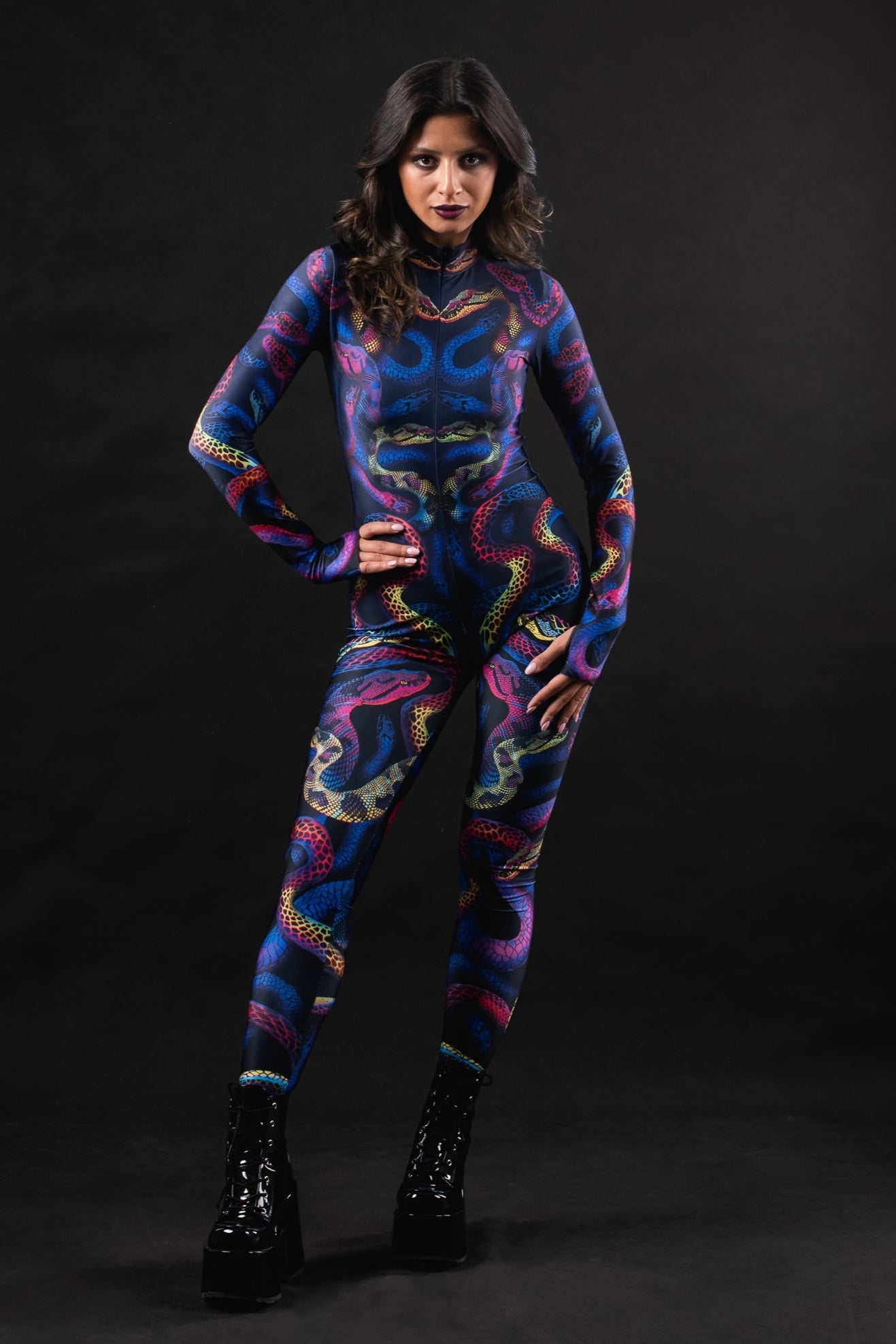 Woman posing in the Snakes & Shades costume, highlighting the bold snake print and colorful design, great for Halloween or as a unique festival outfit.