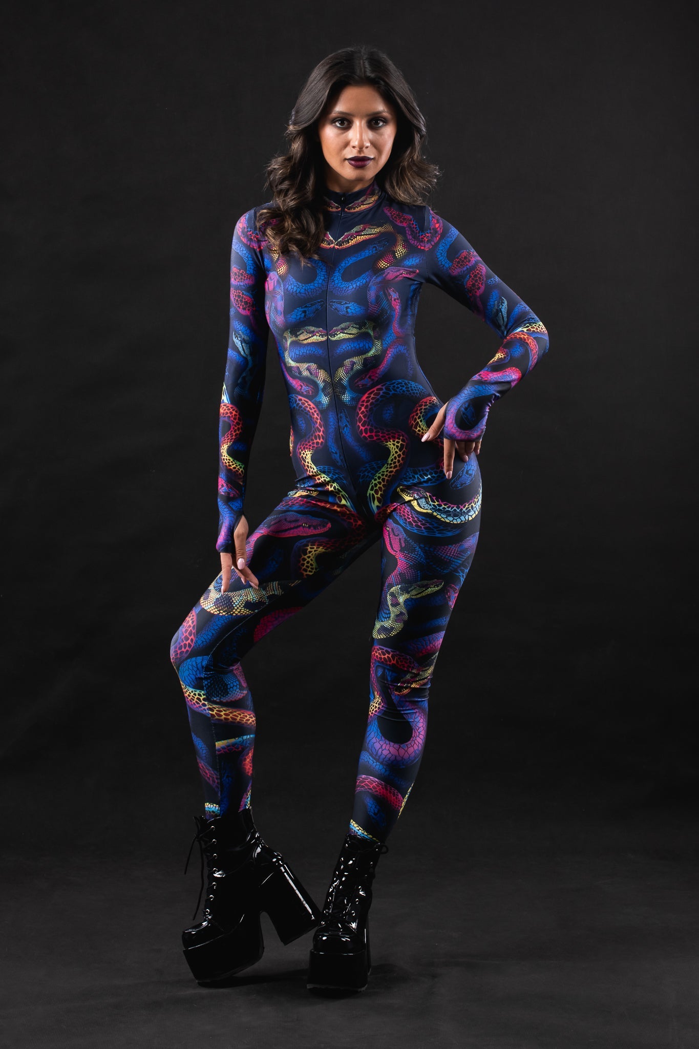 Woman posing in the Snakes & Shades costume, highlighting the bold snake print and colorful design, great for Halloween or as a unique festival outfit.