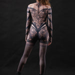 Woman wearing the Lace Temptation costume, a full-body lace outfit with gothic accents, ideal for Halloween, cosplay, or evening events.