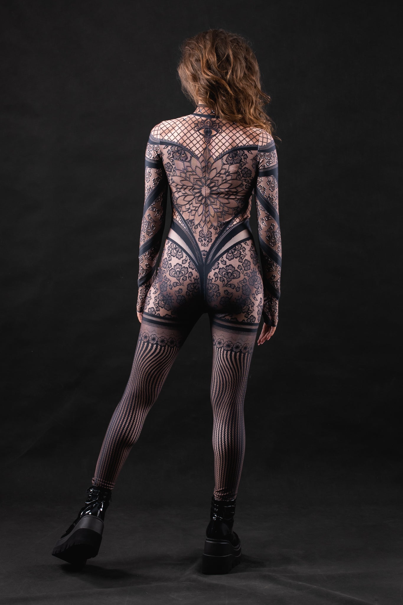 Woman wearing the Lace Temptation costume, a full-body lace outfit with gothic accents, ideal for Halloween, cosplay, or evening events.