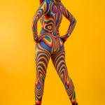 Woman posing in the Rainbow Liquid Festival costume, highlighting the bold rainbow liquid design, great for festivals or as a unique party outfit.