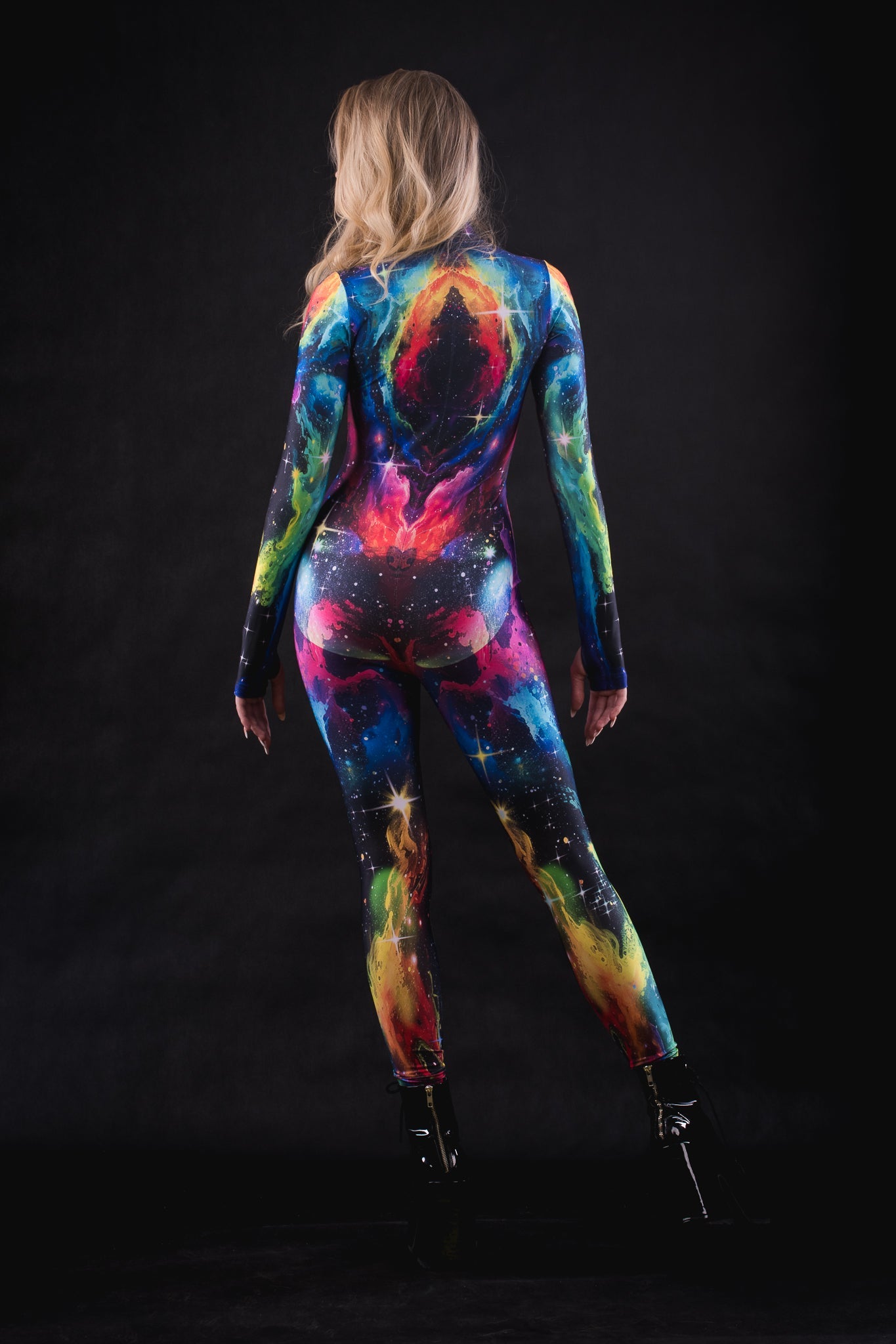 Woman wearing the Galaxy Explorer costume, a full-body suit with vibrant galaxy patterns, perfect for Halloween parties or space-themed festivals.