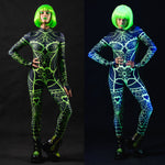 Woman posing in the Green Neon Spiderweb UV Reactive costume, showcasing the glowing green spiderweb pattern under UV light, ideal for Halloween or as a rave outfit.