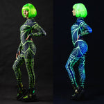 Woman posing in the Green Neon Spiderweb UV Reactive costume, showcasing the glowing green spiderweb pattern under UV light, ideal for Halloween or as a rave outfit.