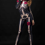 Women wearing a skeleton bodysuit with red rose accents and matching floral cloak, styled for Halloween. The outfit is inspired by Day of the Dead with intricate sugar skull face makeup and a crown of red roses.