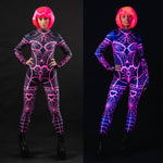 Woman wearing the Pink Neon Spiderweb UV Reactive costume, a full-body suit with glowing spiderweb accents, perfect for Halloween or festival events.