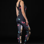 Woman wearing the Skull Butterflies Halloween jumpsuit, a black catsuit with skull and butterfly accents, ideal for Halloween or Day of the Dead celebrations.