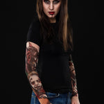 Woman wearing the Zombie Halloween T-shirt with tattoo mesh sleeves, a long-sleeve shirt featuring detailed zombie-themed tattoo prints, perfect for Halloween events.