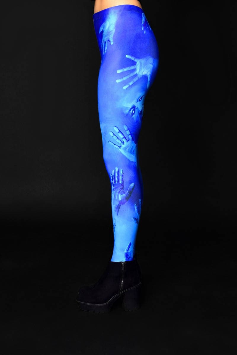 Woman posing in Ghost Scream Halloween leggings, showcasing the eerie ghost-inspired design, great for Halloween or as a unique addition to gothic fashion.