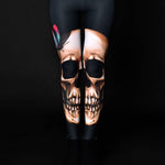 Woman posing in Skull Butterflies Halloween leggings, showcasing the unique skull and butterfly design, perfect for Halloween or as a statement piece in gothic fashion.