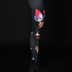 Woman wearing Skull Butterflies leggings, with detailed skull and butterfly prints, ideal for Halloween events or as part of a gothic outfit.