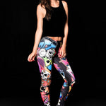 Woman wearing Skull Graffiti Style leggings, featuring colorful skull graffiti prints, perfect for Halloween parties, yoga, or as edgy casual wear.