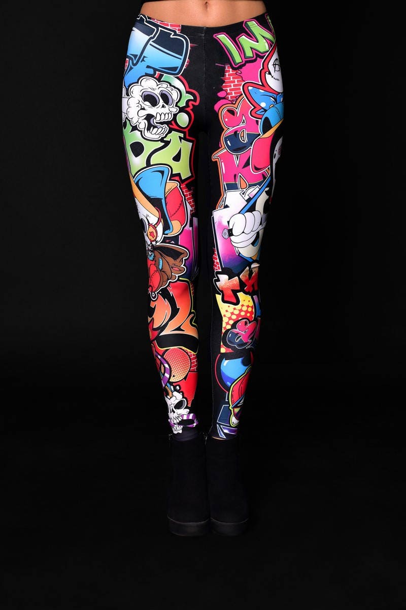 Woman wearing Skull Graffiti Style leggings, featuring colorful skull graffiti prints, perfect for Halloween parties, yoga, or as edgy casual wear.