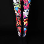 Woman wearing Skull Graffiti Style leggings, featuring colorful skull graffiti prints, perfect for Halloween parties, yoga, or as edgy casual wear.