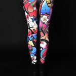 Woman posing in Skull Graffiti Style Halloween leggings, highlighting the detailed graffiti skull design, great for Halloween or as a stylish statement piece.