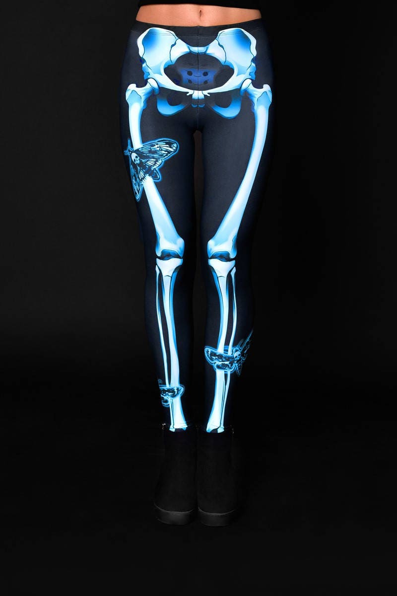 Woman wearing the Skeleton Moth leggings, featuring a detailed skeleton and moth design, perfect for Halloween parties, yoga, or gothic fashion.