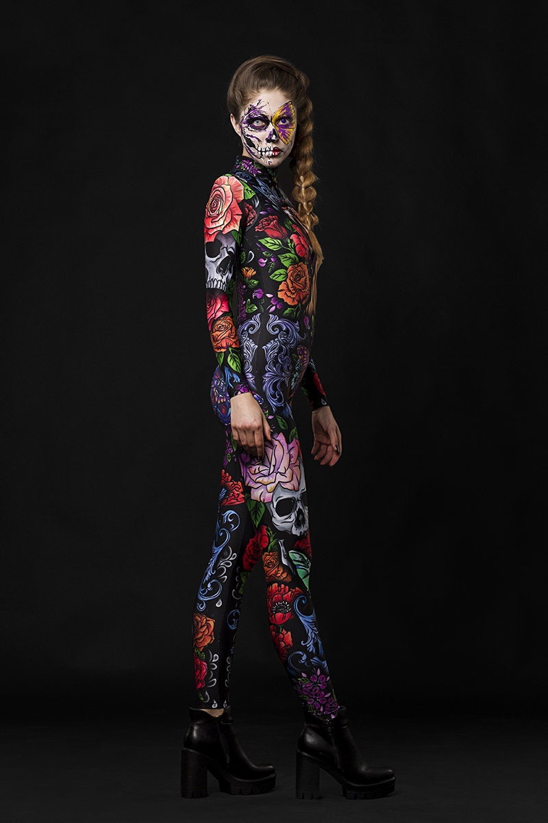 Woman posing in the Tattoo Style Halloween catsuit, showcasing the detailed tattoo-style tiger, skull, and butterfly designs, great for Halloween or as a standout festival outfit.