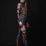 Woman posing in the Tattoo Style Halloween catsuit, showcasing the detailed tattoo-style tiger, skull, and butterfly designs, great for Halloween or as a standout festival outfit.