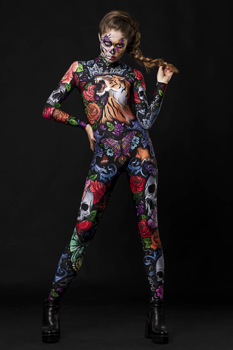 Tattoo Style Halloween costume for women, featuring a full-body catsuit with tiger, skull, and butterfly designs, perfect for Halloween parties or festival cosplay.