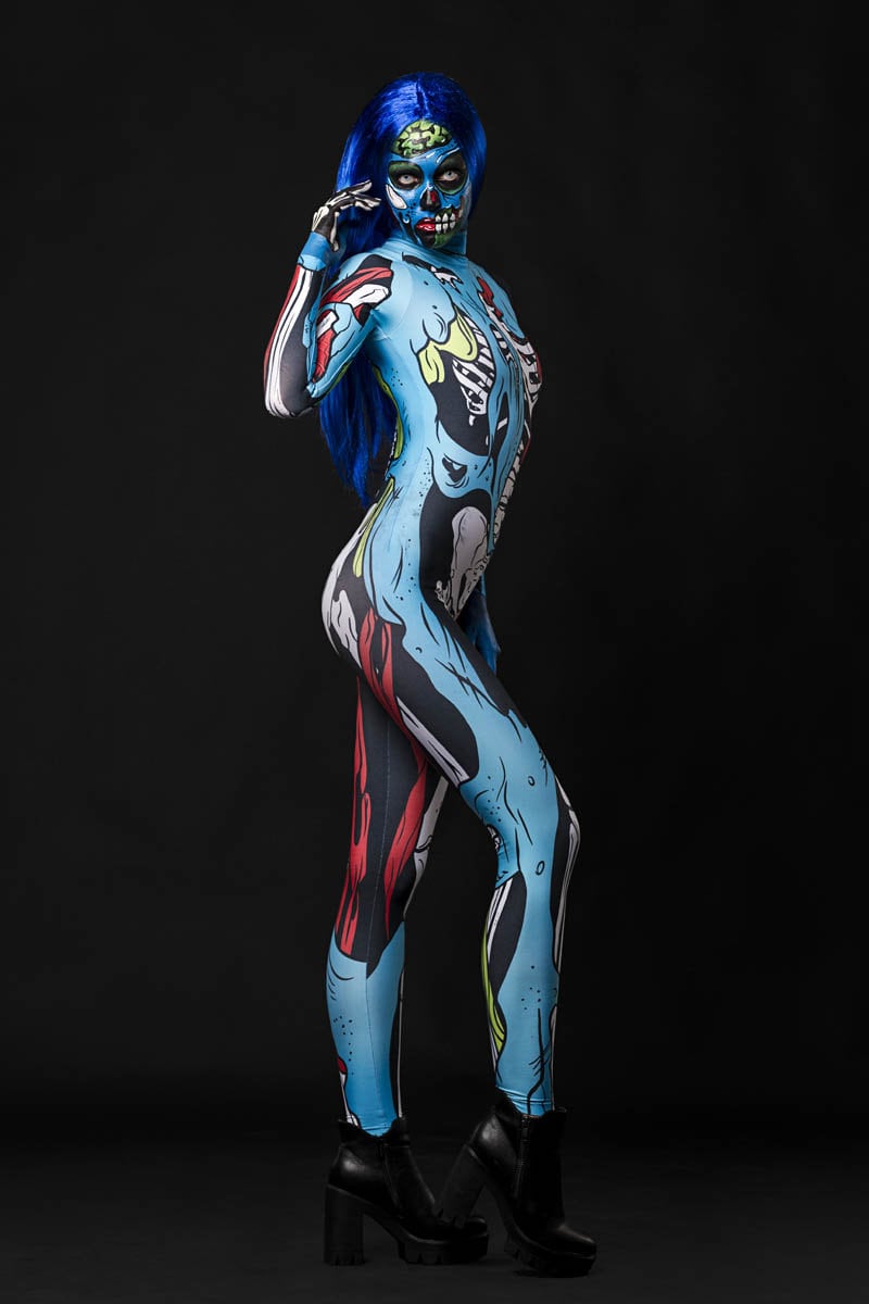 Model posing in the Zombie Skeleton Halloween costume, highlighting the blue comic-style skeleton and zombie design, great for Halloween parties or as a standout cosplay outfit.