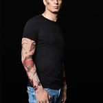 Man wearing the Spiders Halloween T-shirt with spiderweb and bloody tattoo sleeves, ideal for Halloween events or gothic style.