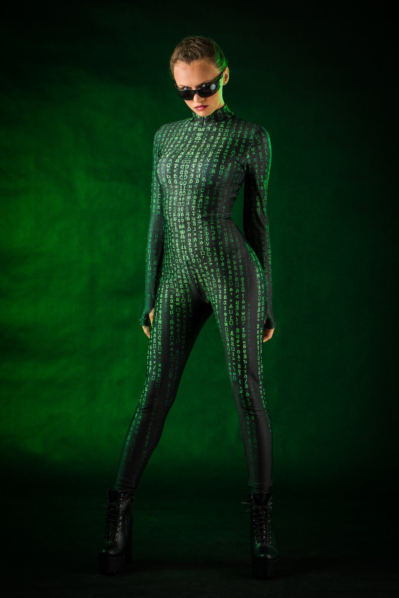 Woman posing in the Matrix Halloween costume, highlighting the sleek black jumpsuit with tattoo details and White Rabbit theme, perfect for Halloween or as a unique cosplay outfit.