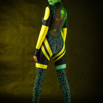 Woman posing in the Green Alien Halloween costume, showcasing the sleek green jumpsuit and tattoo effect, great for Halloween or as a standout festival outfit.