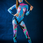 Woman wearing the Sweet Ice Cream Skulls costume, a full-body jumpsuit with colorful skulls and ice cream motifs, perfect for Halloween or cosplay festivals.