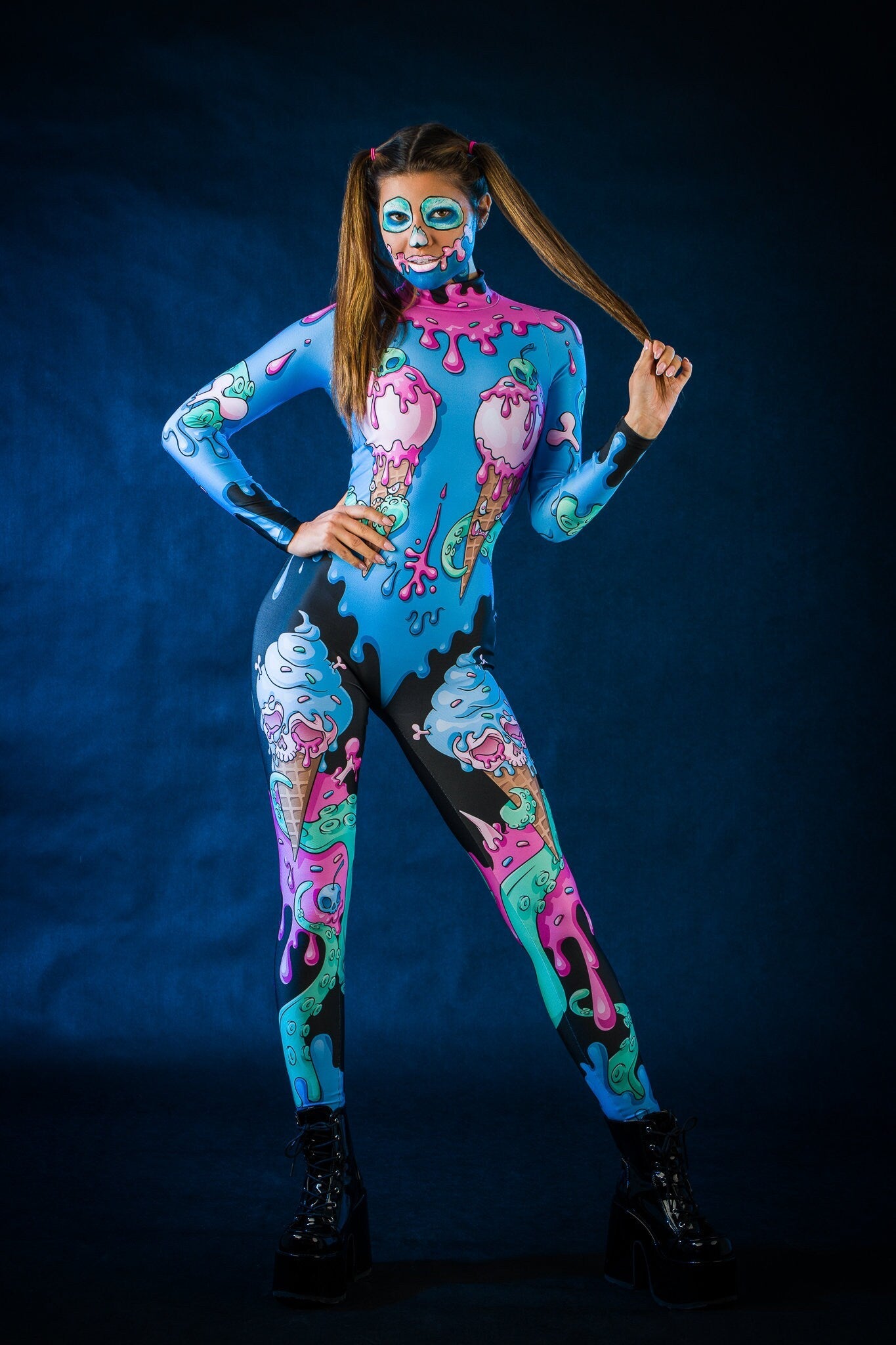 Woman wearing the Sweet Ice Cream Skulls costume, a full-body jumpsuit with colorful skulls and ice cream motifs, perfect for Halloween or cosplay festivals.