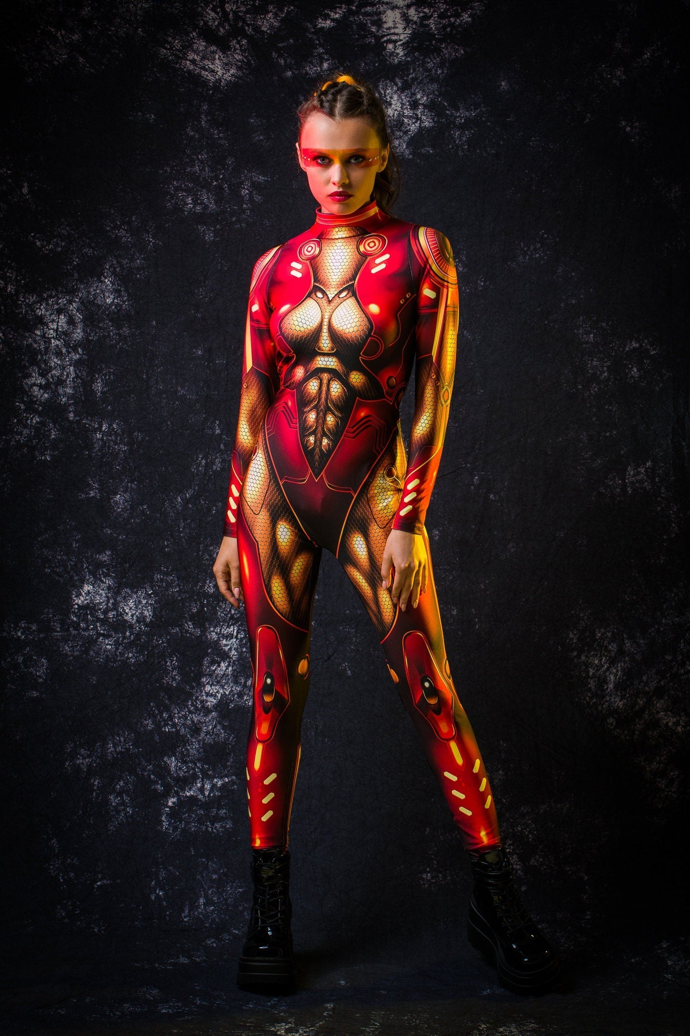 Red Gold Cyber Hero Halloween costume for women, featuring a full-body robotic design with cyberpunk and superhero elements, perfect for Halloween or cosplay events.