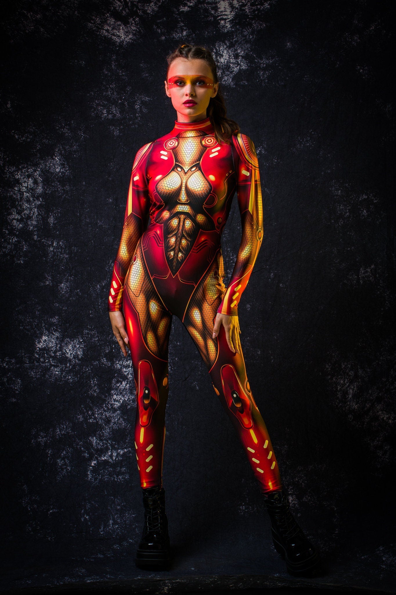 Red Gold Cyber Hero Halloween costume for women, featuring a full-body robotic design with cyberpunk and superhero elements, perfect for Halloween or cosplay events.