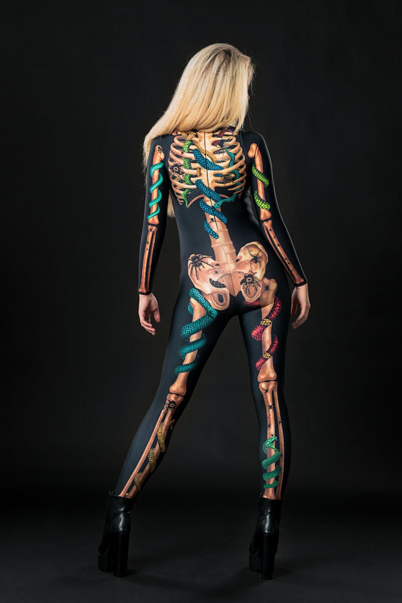 Close-up of the detailed snake, spider, and skeleton design on the full-body catsuit, ideal for a bold Halloween or gothic festival look.