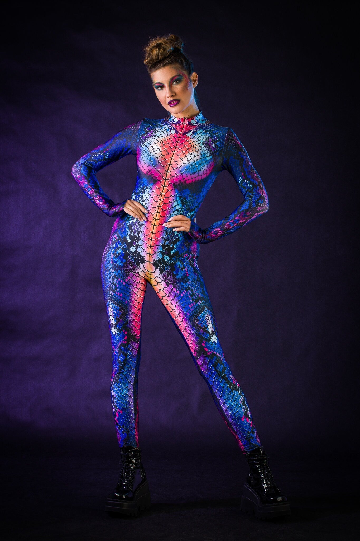 Blue Snake Halloween costume for women, featuring a snake skin jumpsuit with tattoo effect on the back, perfect for Halloween parties or music festivals.