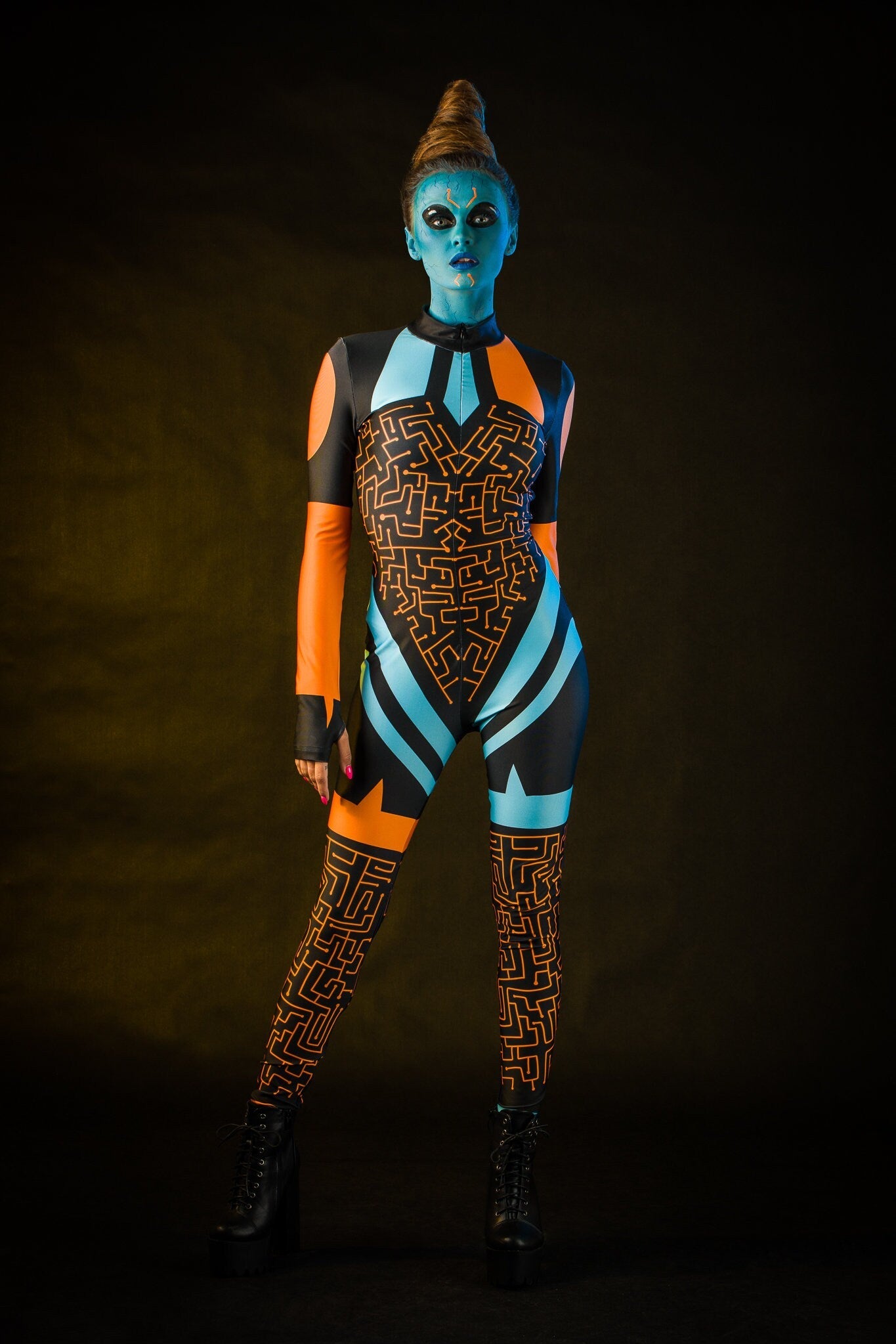 Blue Alien Halloween costume for women, featuring a full-body jumpsuit with tattoo effect on the back, inspired by UFO and alien themes, perfect for Halloween or cosplay events.