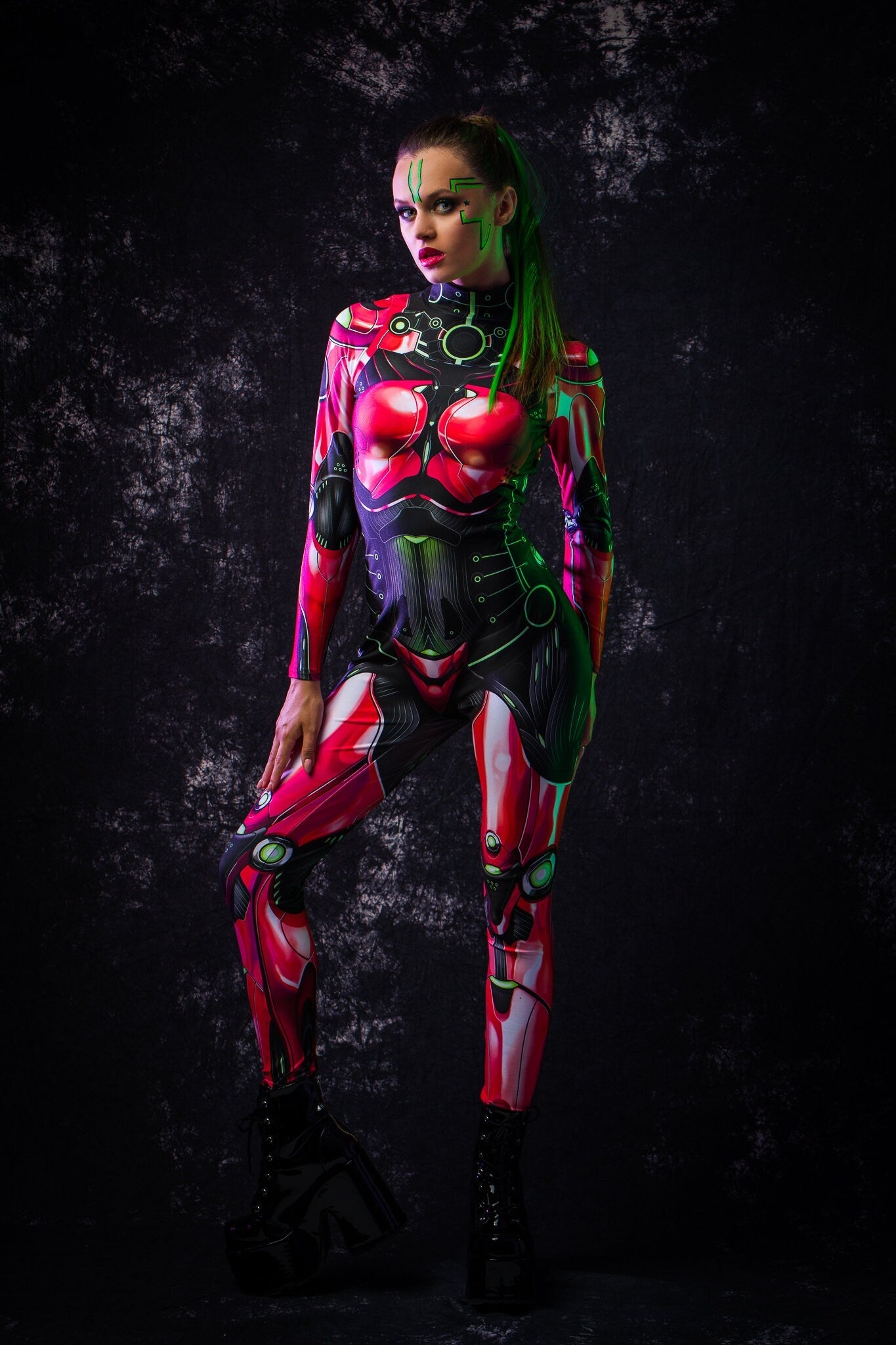 Red Android Halloween costume for women, featuring a full-body robotic catsuit with cyberpunk elements, perfect for Halloween or cosplay events.