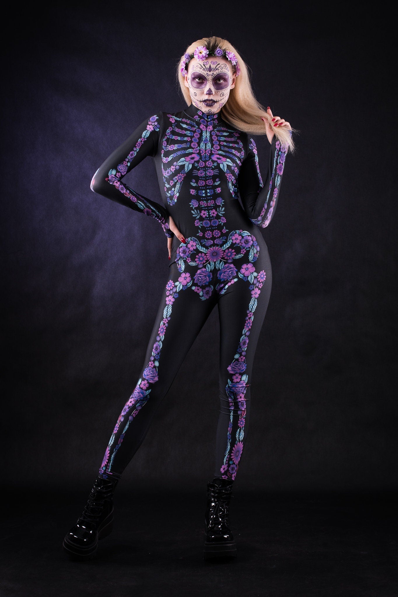 Woman posing in the Flower Skeleton costume, showcasing vibrant purple and blue skeleton design with flowers, ideal for Halloween or as a striking festival outfit.