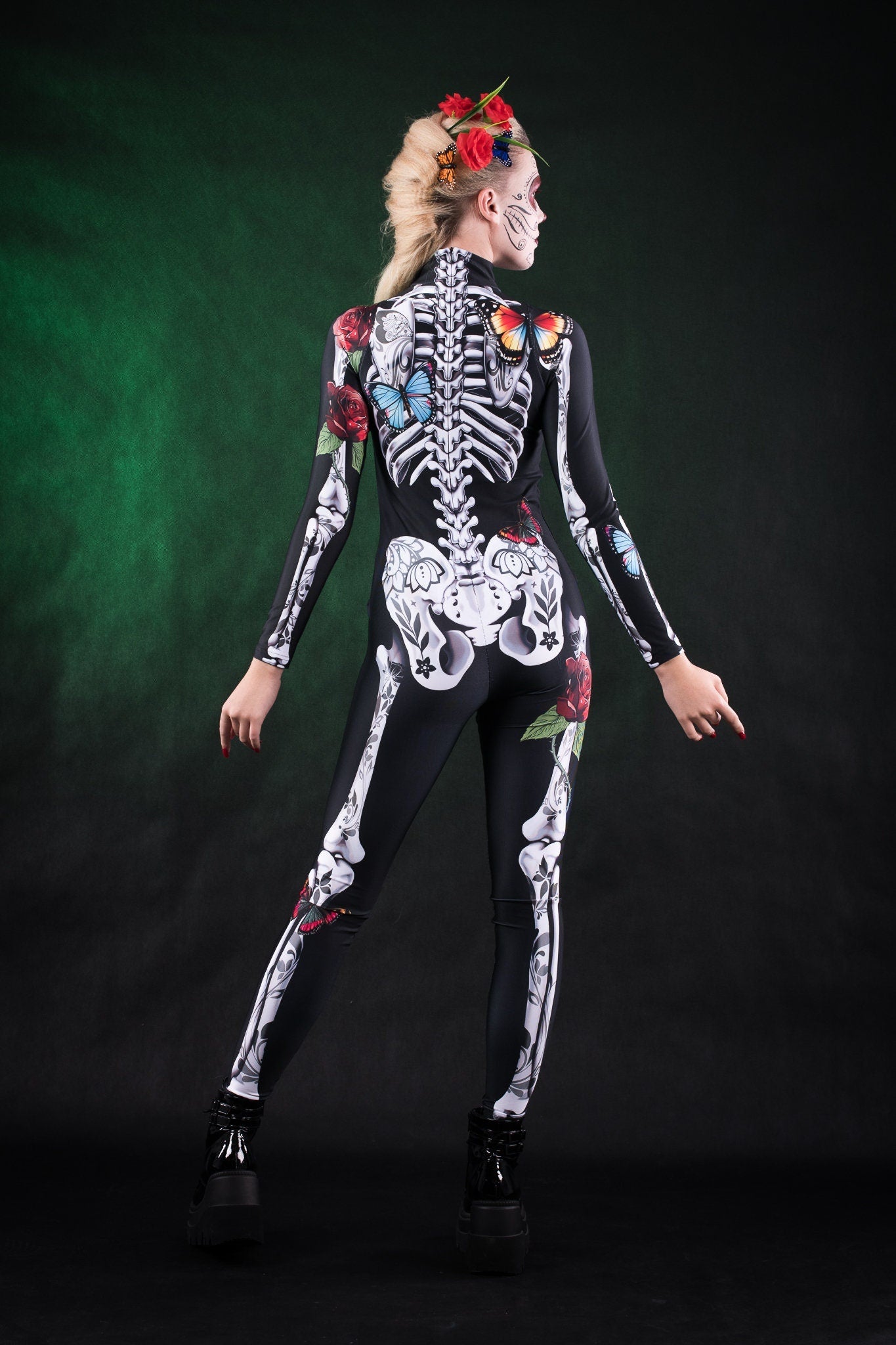 Close-up of the skeleton design with rose and butterfly details on the full-body catsuit, ideal for a unique Halloween or festival look.