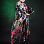 Woman wearing the Roses and Butterflies Kimono Halloween cape, with detailed floral and butterfly designs, perfect for Day of the Dead events or Halloween parties.