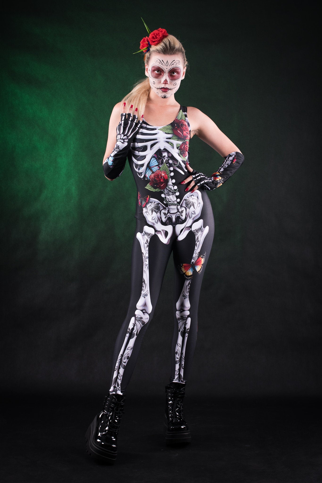 Woman posing in the Roses Butterflies Skeleton jumpsuit with kimono, highlighting the vibrant floral and skeleton design, great for Halloween or as a standout festival outfit.