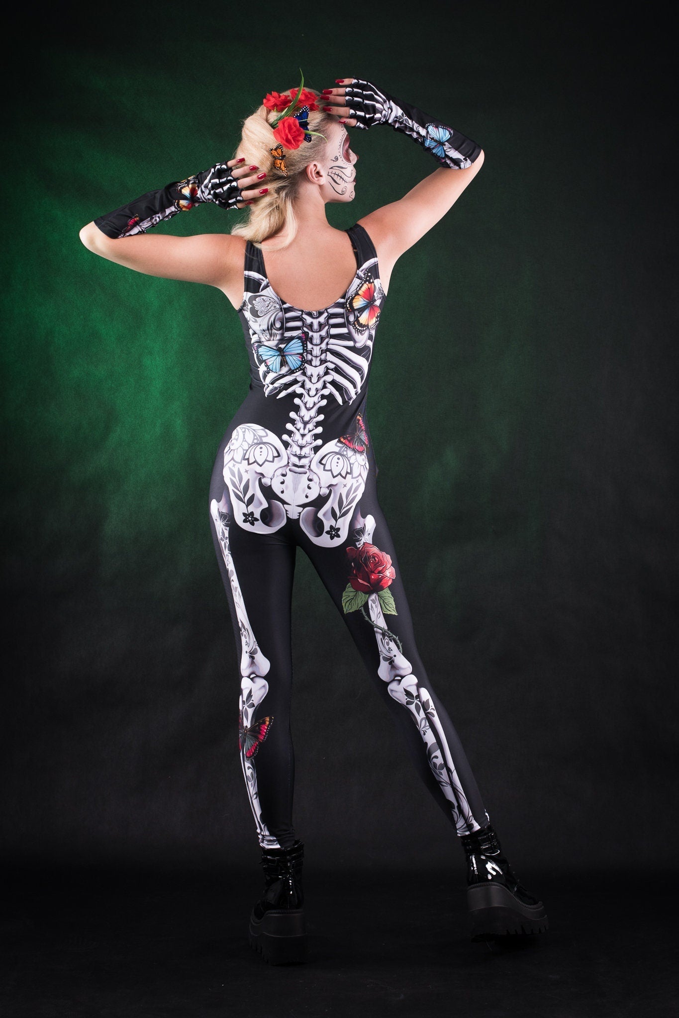 Close-up of the white skeleton design with detailed rose and butterfly accents on the jumpsuit and matching kimono, ideal for Halloween or festival fashion.