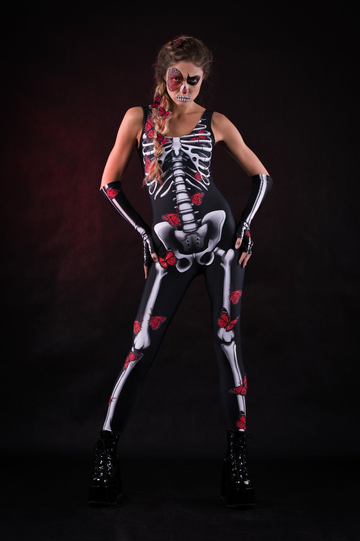 Woman posing in the Red Butterflies Skeleton jumpsuit and kimono set, showcasing the detailed skeleton and butterfly design, great for Halloween or as a standout festival outfit.