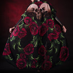 Woman wearing the Lady Death kimono Halloween cape, featuring a black cape with skull and rose accents, perfect for Halloween or Day of the Dead events.