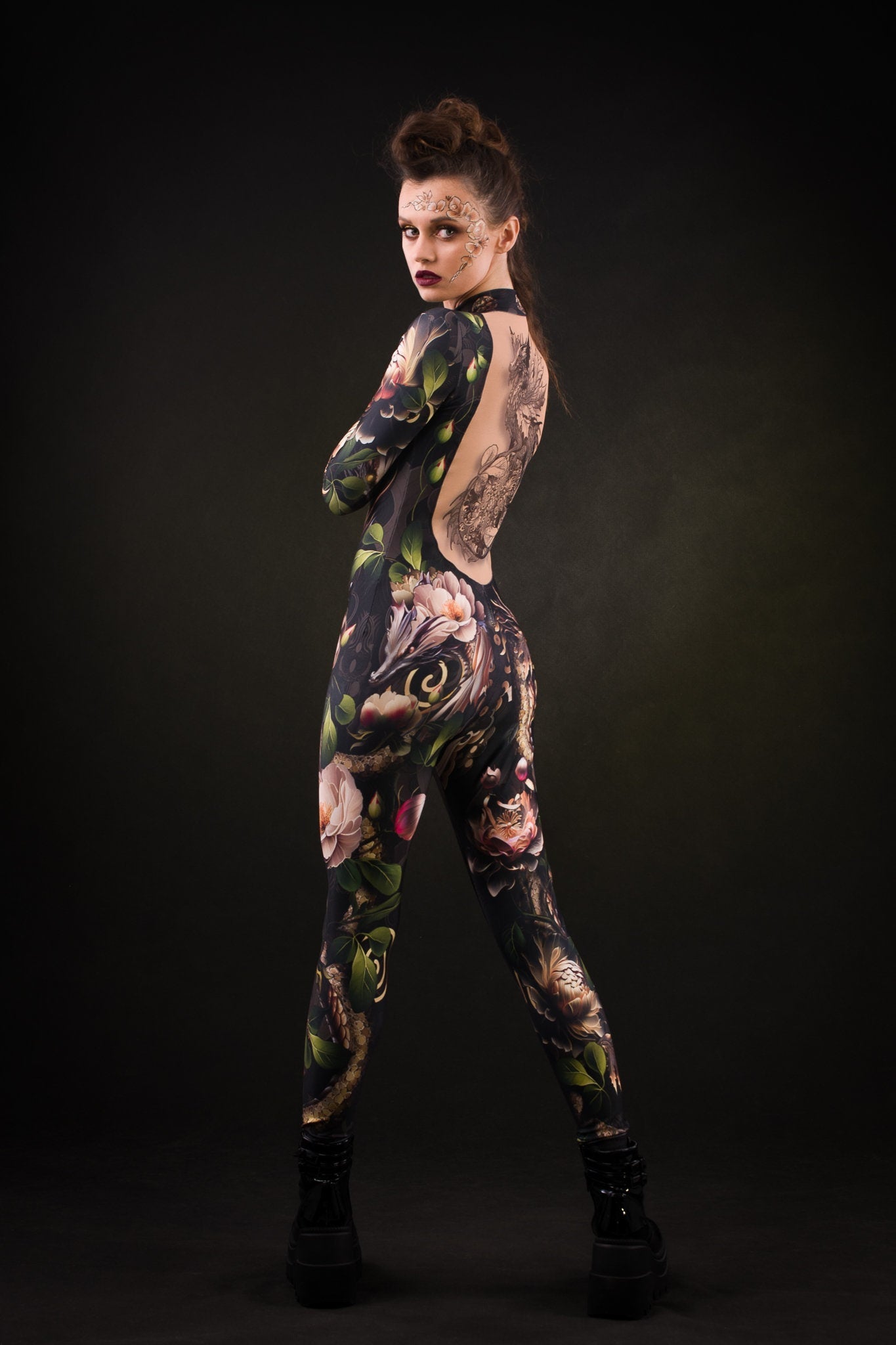 Close-up of the intricate dragon design and tattoo effect on the back of the Sister of Dragons catsuit, ideal for a bold Halloween or festival look.