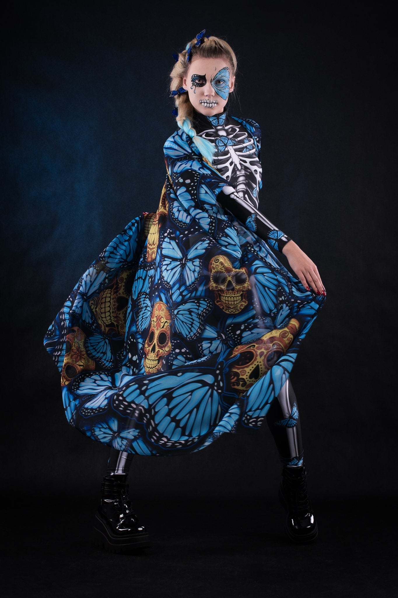 Woman posing in the Lady Blue Butterfly skeleton costume, highlighting the vibrant blue butterfly design, skeleton theme, and flowing kimono, great for Halloween or as a unique festival outfit.