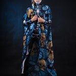 Woman posing in the Blue Monarchy Butterflies Halloween cape, highlighting the dramatic flow and vibrant butterfly details, great for a Day of the Dead-inspired look or festival wear.